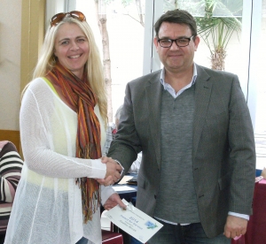 Andrea Bevan receiving her award from NZPF President, Mark Benvie.